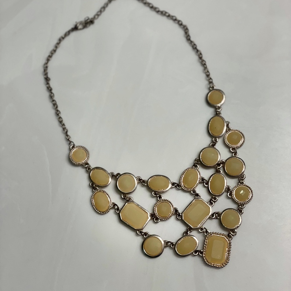 Off white jewel statement necklace.